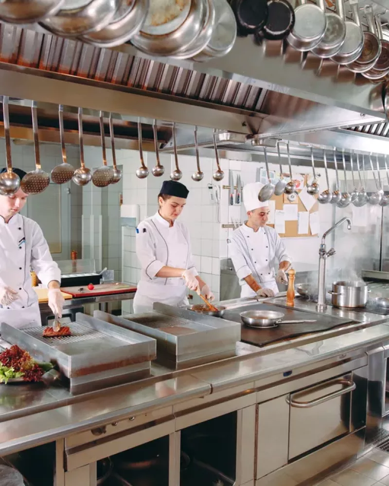 Modern kitchen. The chefs prepare meals in the restaurant's kitchen.